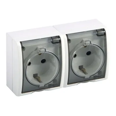 Base doble, superficie, schuko 2p+t, 16a 250v~, ip54, serie aquarius, blanco con tapa transparente, blister